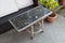 Reuse of an old letter press printing tray into a garden table