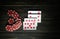 Revealed playing cards with a winning combination of two pairs lie on a vintage black table in a poker club. Winning in poker