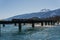 REVELSTOKE, CANADA - MARCH 15, 2020: cargo train railway bridge crossing columbia river on a sunny spring day