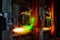 Reverberatory furnace melts copper metal with burning flame