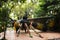 Reverend Luang Phor Kong sit on Giant large Phaya Hornet wasp in Khum Khun Phaen garden park in Wat Khae temple for thai people