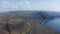 Reverse aerial view of beautiful wilderness of iceland landscape. Drone view of spectacular black volcanic sand beach in