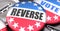 Reverse and elections in the USA, pictured as pin-back buttons with American flag colors, words Reverse and vote, to symbolize