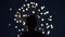 Reverse slow motion shot of silhouette of a man watching fireworks. Close-up