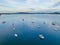 Reverse sunset pale blues waterscape with boats and high cloud