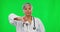 Review, green screen and face of a doctor wuth a thumbs down isolated on a studio background. Unhappy, mature and a