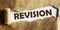 Revision text is written on torn paper