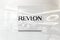 Revlon on glossy office wall realistic texture