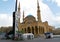 Revolutionary hand monument at public square in Beirut with mosque in the background