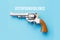 A revolver on a blue background with a wooden handle. Generative AI image. Stop gun violence.