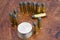 Revolver cartridges and Silver Dollar Wild West period on wooden background