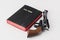Revolver handgun and holly bible on a white surface