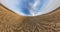 Revolves among fields with beautiful clear sky and white clouds. Little planet Transformation with curvature of space. loop rotate