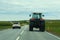 Reykjavik, Iceland - June 23, 2019 - A car passing a big tractor on the Ring Road
