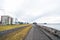 Reykjavik, Iceland - October 12, 2017: city roads along sea on cloudy sky. Promenade at seaside. Freedom, perspective and future.