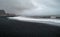 Reynisfjara black sand beach and Reynisdrangar rocks in Iceland at winter.