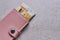 RFID protection wallet in pink with ID, banking cards and Mastercard, copy space