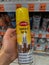 Rheinbach, Germany 17 March 2021,   A can of `Caramba` contact spray in the hands of a customer in front of the shelf   focus on