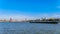 A Rhine Barge on the Nieuwe Maas river in Rotterdam with the red cable stayed Willems Bridge in the background