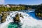 Rhine Falls, Rheinfall, Switzerland panoramic aerial view. Tourist boat in waterfall. Bridge and border between the cantons