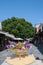 Rhodes, Greece. 05/30/2018. Golden flower vase at market street. Pot with flower
