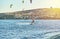Rhodes, Greece - July 08 2017: Men goes kitesurfing on azure sea water against clear sky