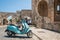 Rhodes, Greece. May 30, 2018.Street view. Scooter parked in front of the remains of the Church of the Virgin of the Burgh. Rhodes
