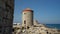 Rhodes, Greece: Medieval windmills at Mandraki harbour at Rhodes City located near port of Mediterranean sea