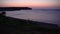 Rhodes, Greece: Tilt upward shot of a golden orange horizon over mediterranean sea during sunrise / sunset. Beauty in nature