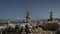 Rhodes, Greece: Timelapse of stones / rock formation piled on each other in the coast against moving clouds above blue