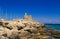 Rhodes harbor with the old fort in the background and stones in the foreground