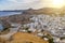Rhodes Island in Greece. City on hill with white residential buildings and touristic hotels