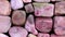 Rhodochrosite heap jewel stones filled texture on black background. Moving right seamless loop backdrop