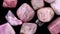 Rhodochrosite heap up jewel stones texture on black background. Moving right seamless loop backdrop