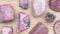 Rhodochrosite rare jewel stones texture on light varnished wood background. Moving right seamless loop backdrop