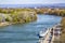 Rhone river with a large pleasure boat near the pier