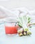 Rhubarb jam or jelly on light table background in sunlight with ingredients. Seasonal homemade  preserving concept