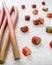 Rhubarb and Rhubarb Pieces on White Marbled Background