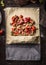 Rhubarb and strawberries strudel pie preparation. Dough sheet with sliced ingredients sugar and starch powder on rustic kitchen