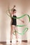 Rhythmic gymnastics. Graceful ballerina in motion