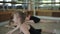 Rhythmic gymnastics. Three girls warm up in the gym.
