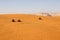 Riad, Saudi Arabia, February 15 2020: Three young Saudis are driving their quads in the red sand dunes south of Riyadh
