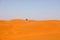 Riad, Saudi Arabia, February 15 2020: A young Saudi man is driving his quad alone in the huge sand dunes south of Riyadh