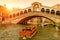 Rialto Bridge over the Grand Canal at sunset, Venice, Italy. It is a famous landmark of Venice