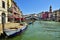 Rialto Bridge PONTE DI RIALTO and canal in Venice, typical architecture of Italy