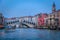 Rialto and ornate Gondolas in Grand Canal pier at sunset, Venice, Italy