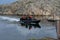 A RIB boat in a narrow canal between two islands. Picture from the Weather Islands archipelago, the western most point