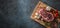 Rib Eye steak salt pepper spices garlic and mushroom. Raw beef meat on butcher board - top of view