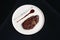 Rib eye steak on white plate, close-up. Sliced tenderloin steak