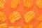 Ribbed potatoes snack with pepper on pastel orange background. Ridged potato chips on orange background. Collection